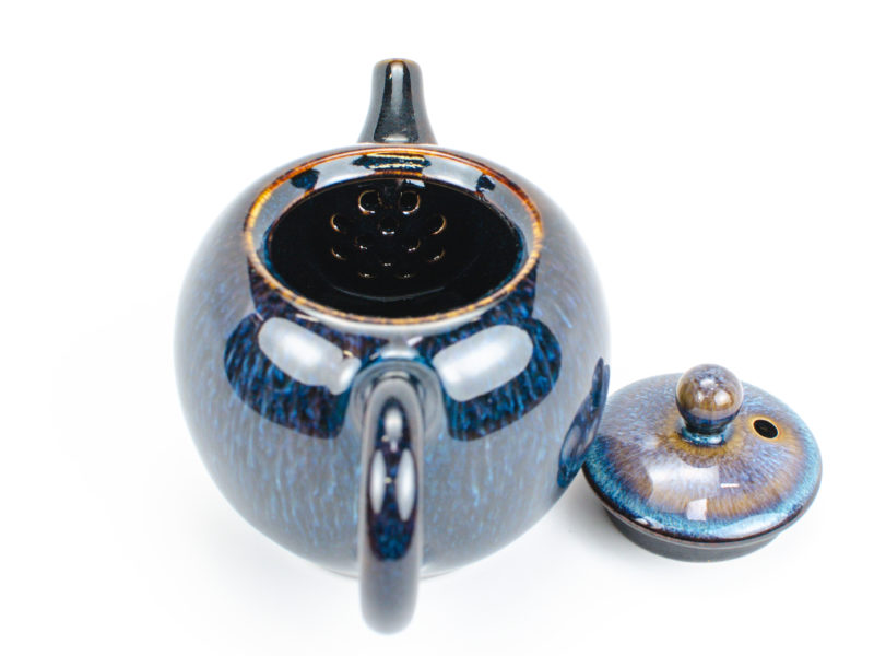 Jun Kiln Round Blue Ceramic Teapot with lid open to show the strainer bulb inside behind the spout.