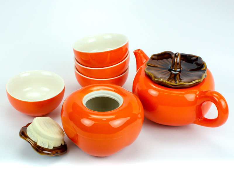 Persimmon Porcelain Tea Set unpacked with the leaf-shaped lid of the caddy removed.