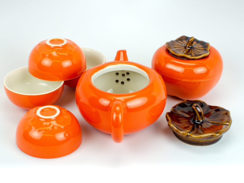 Persimmon Porcelain Tea Set unpacked with the teapot's leaf-shaped lid removed to show the strainer behind the spout.