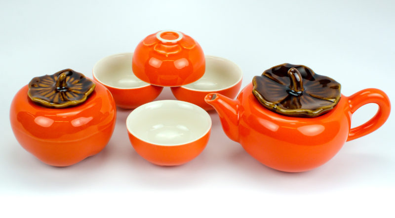 Persimmon Porcelain Tea Set unpacked in all 6 pieces, including teapot, tea caddy, and 4 teacups.