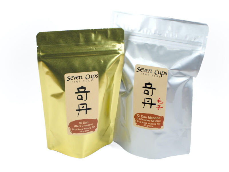 Two packages of Qi Dan Maocha and yancha in foil bags.