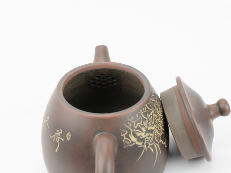 Inset strainer behind spout inside Bell Shaped Golden Fish Pond Guangxi Nixing Teapot