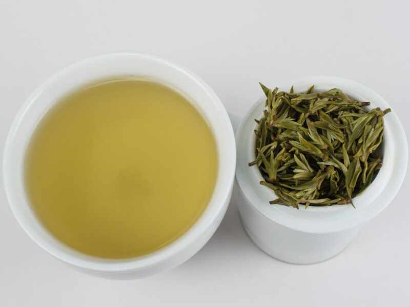 First Pluck Sweet Dew green tea and strained leaves.
