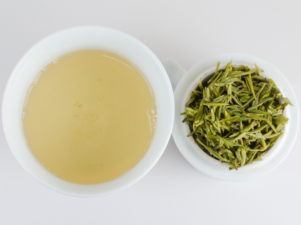 Infusion of First Pluck Sweet Dew green tea and infused leaves.