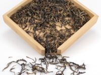 Baotang Pond Sun-Dried black tea dry leaves in a wooden display box.