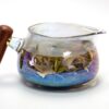 Goldfish Rainbow Glass Pitcher with Wood Handle filled with tea