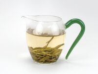 Green Handle Glass Pitcher with tea inside