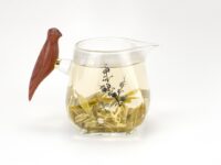 Wooden Bird Handle Glass Pitcher with tea, cherry branch detail