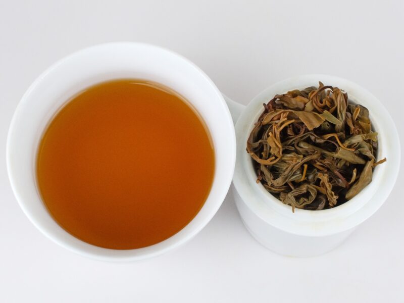 Cupped infusion of Eagle Tree herbal tea and strained leaves.