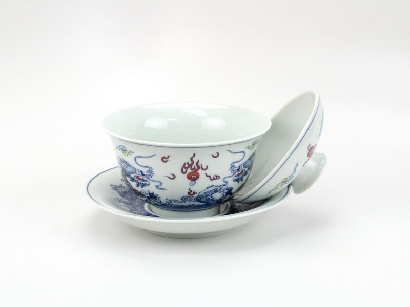 Balanced Lid Double Dragon Porcelain Gaiwan with lid balanced between bowl and saucer