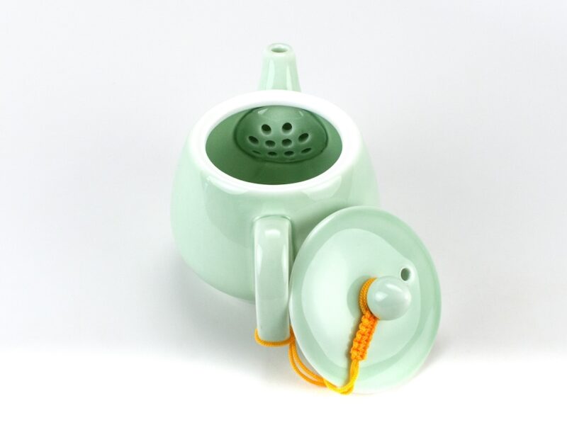 Classic Plum Green Celadon Teapot view of inset strainer behind spout