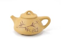 Carved bamboo detail on Carved Yellow Stone Scoop Duan Ni Yixing Teapot