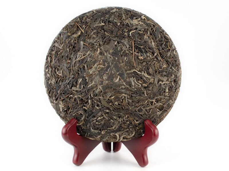 Yanzi Tou (Rock Head) Sheng Puer Cake whole and unbroken without its wrapper.