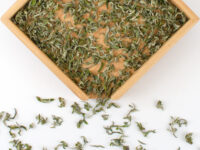 Bao Zhu Ganlu (Firecracker Sweet Dew) green tea dry leaves.