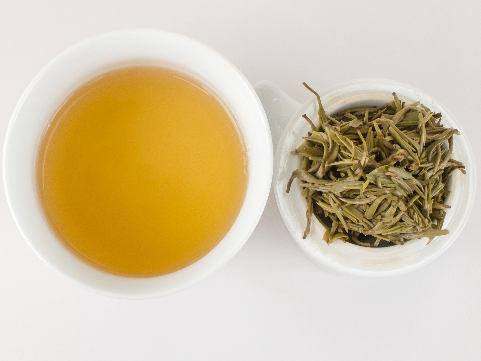 Cupped infusion of Moli Fu Hua (High Summer Jasmine) scented green tea and strained leaves.