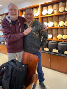 2 men hugging in a teahouse