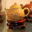 Floating Dragon A Floating Dragon Zisha Tea Pot sitting on top of a wooden tray